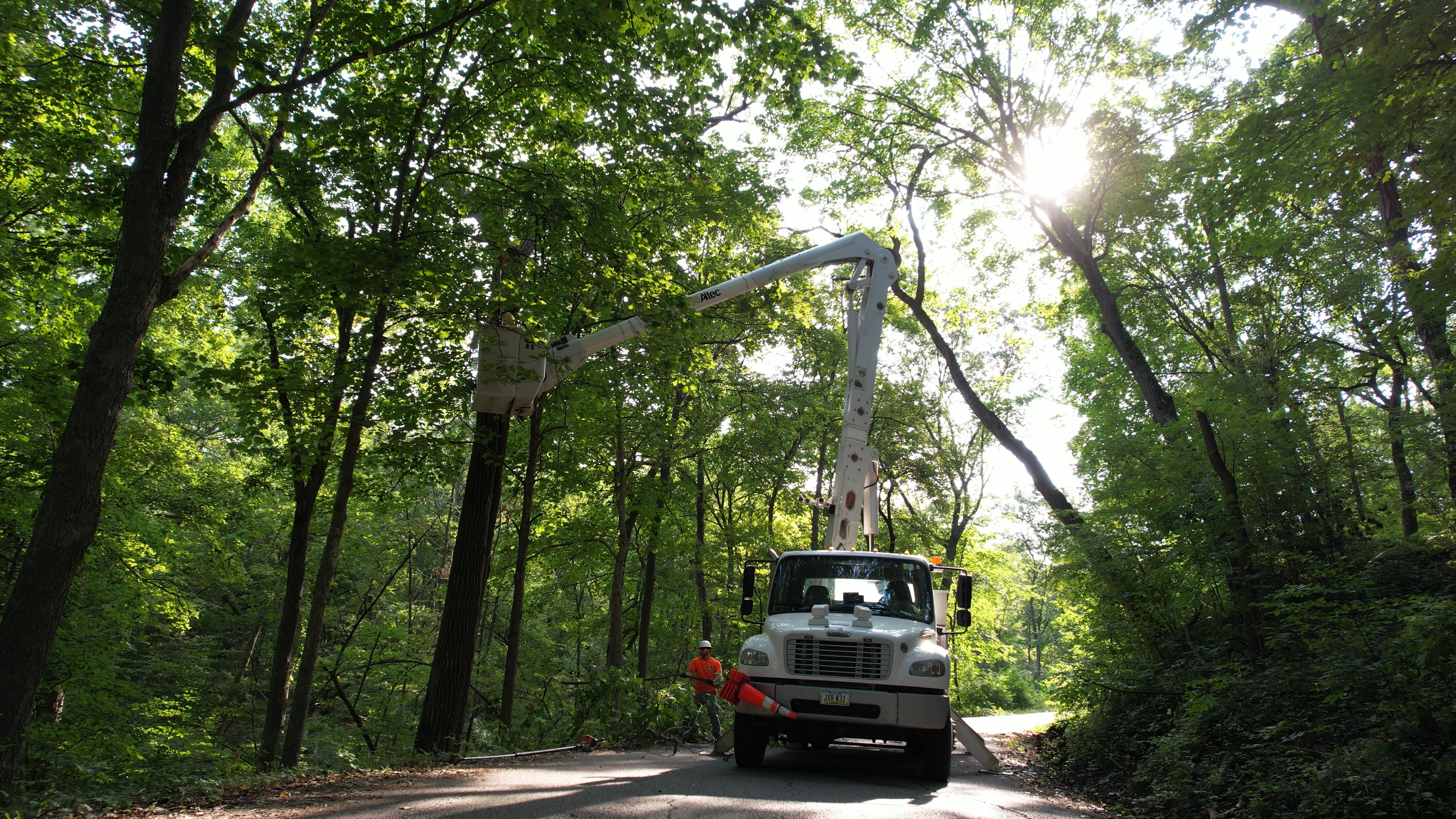 A bucket truck trims trees at Ledges State Park 